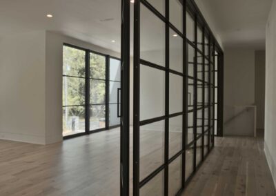 Interior-steel-glass-wall-with-industrial-muntins