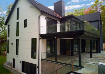 Side-elevation-of-the-house-with-glass-railings-and-sliding-doors
